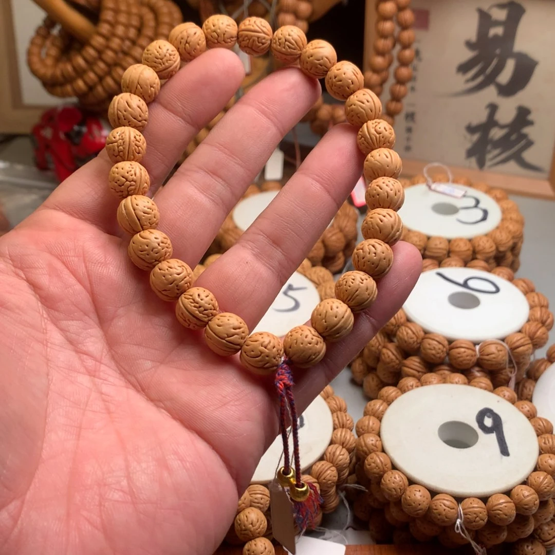 柒***༨桃核手串1.2小金芽桃核手持
