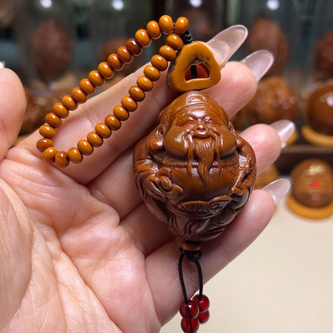 橄榄核把件玉化财神手把