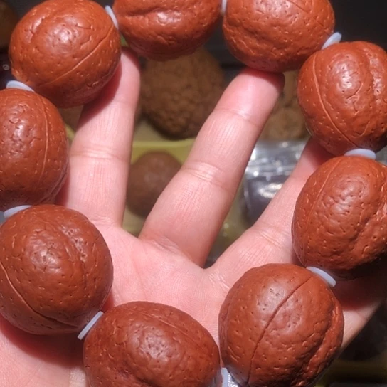 文玩核桃把件巴*三瓣光头强金刚菩提手把件