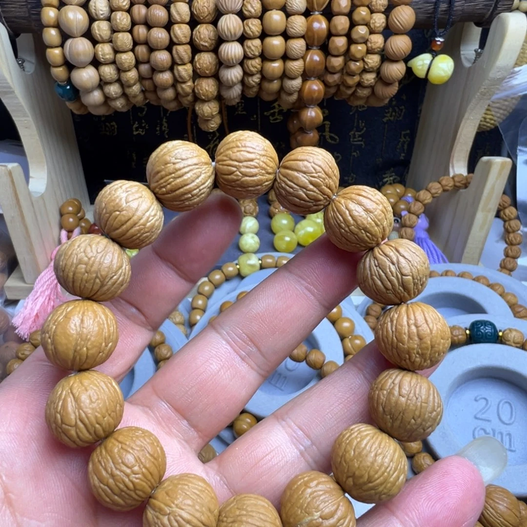 猴头核桃手串新人福利无暇原皮凤羽