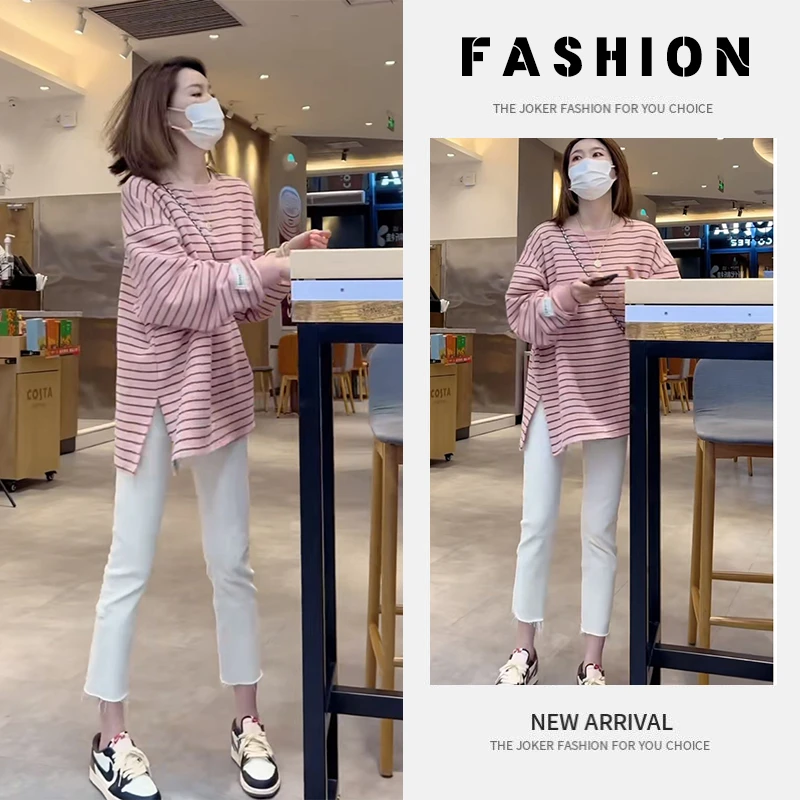 早春女装2025新款一整套穿搭拼接开叉条纹卫衣牛仔铅笔裤两件套装