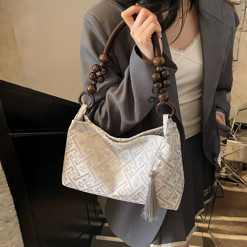 新中式国风手提包包女2025新款秋冬刺绣百搭单肩腋下包通勤法棍包