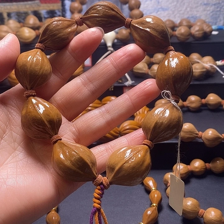 北***刘橄榄核手串四花23×31