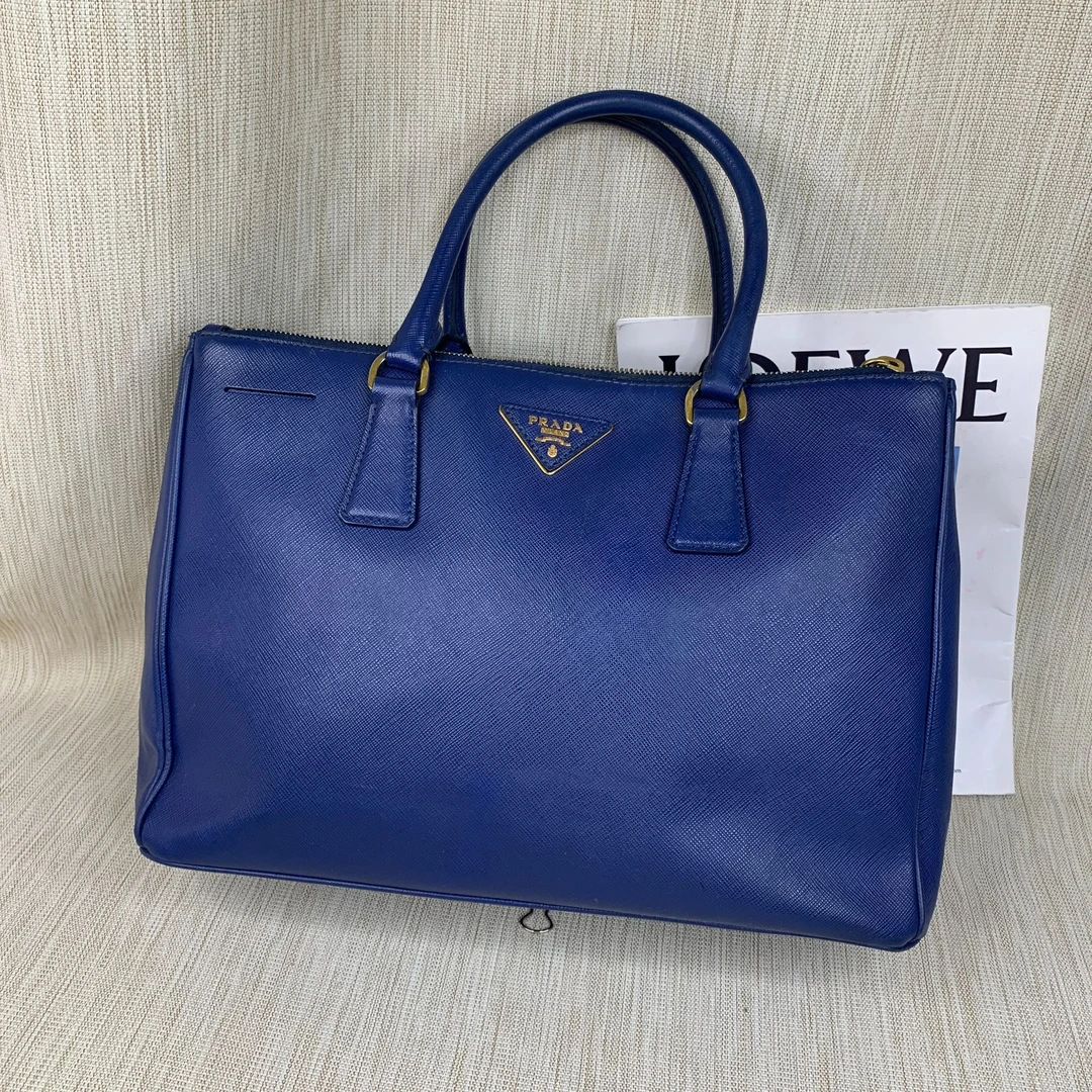 95新 Prada/普拉达 蓝金杀手包/EE08828001/8001