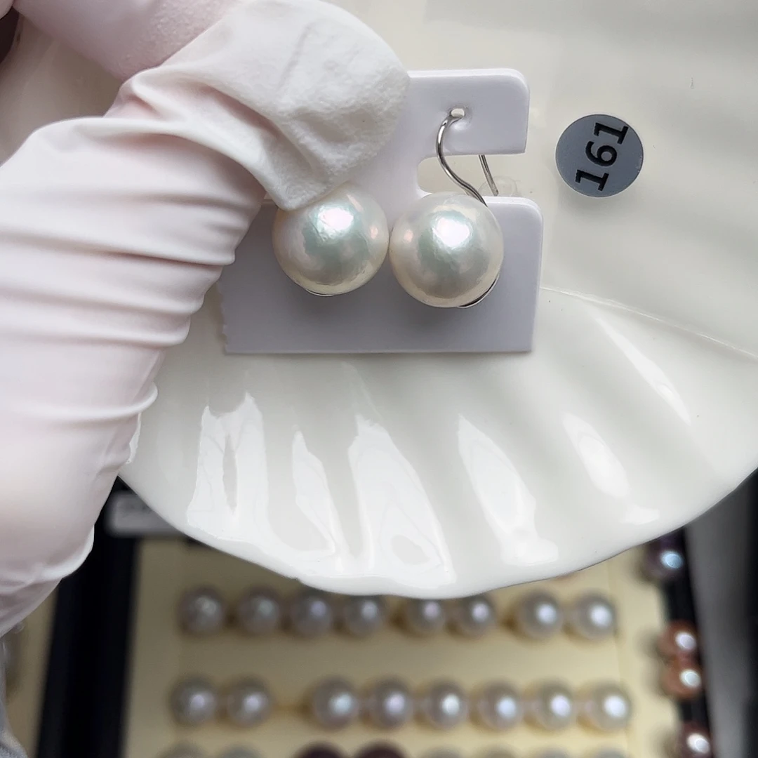 紫***瑩淡水珍珠银S925镶嵌耳饰