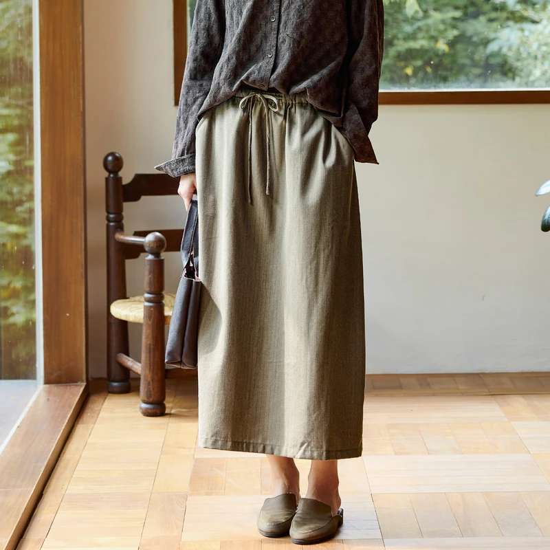 qtu高定100支美利奴羊毛精纺半身裙松紧腰春秋新款a字裙 卡其风迹