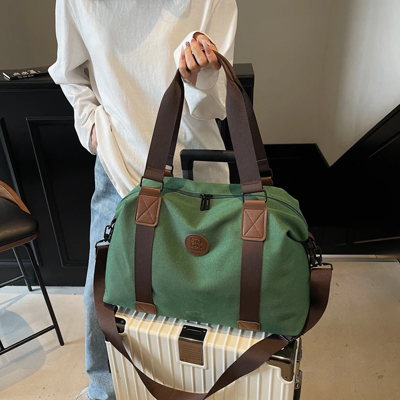 时尚帆布旅行包女2025新款轻便短途出差行李包男大容量百搭健身包
