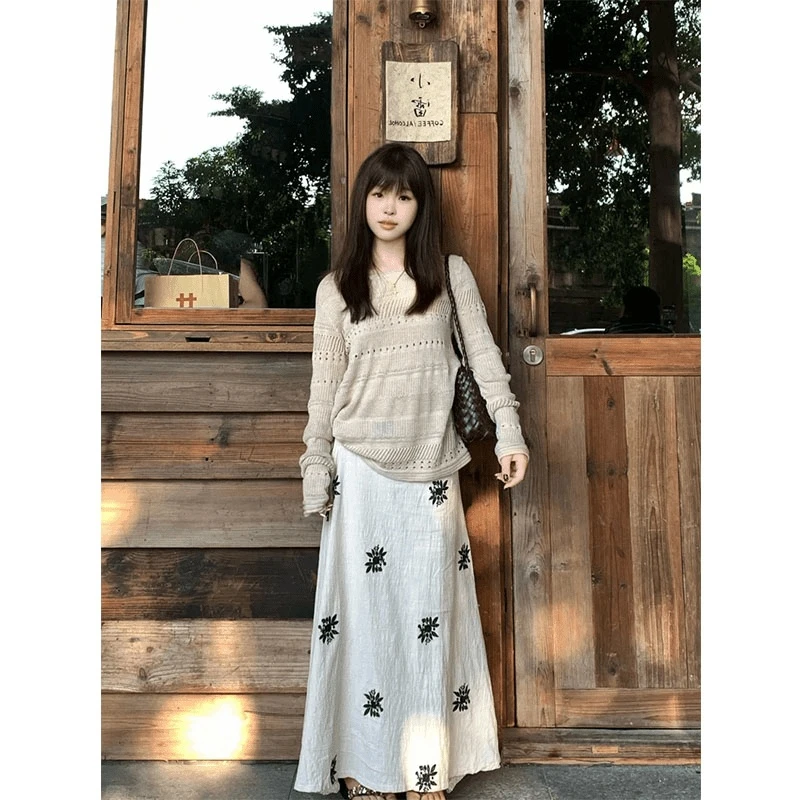 2025年早秋新款氛围感穿搭镂空女慵懒高级感针织上衣设计感半身裙