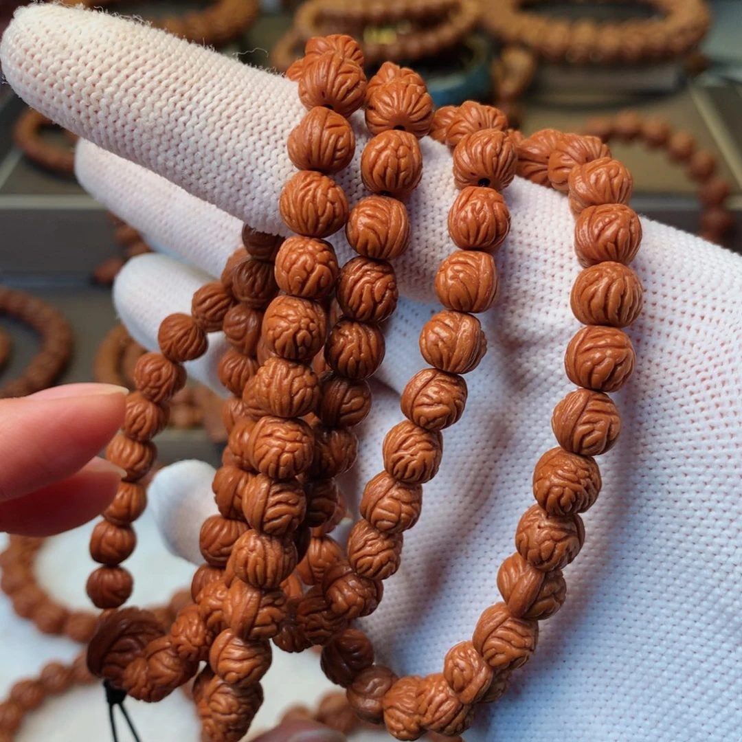 腻***_桃核手串秦岭龙纹