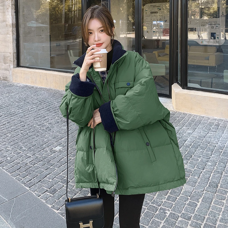 今年流行爆款绿色收腰羽绒服女冬季2024新款设计感保暖白鸭绒外套
