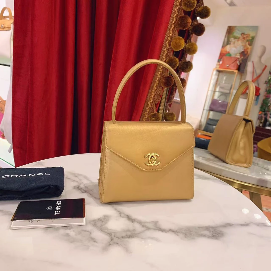 95新 Chanel/香奈儿 mini Kelly香槟金色金扣手提包牛皮/30151819