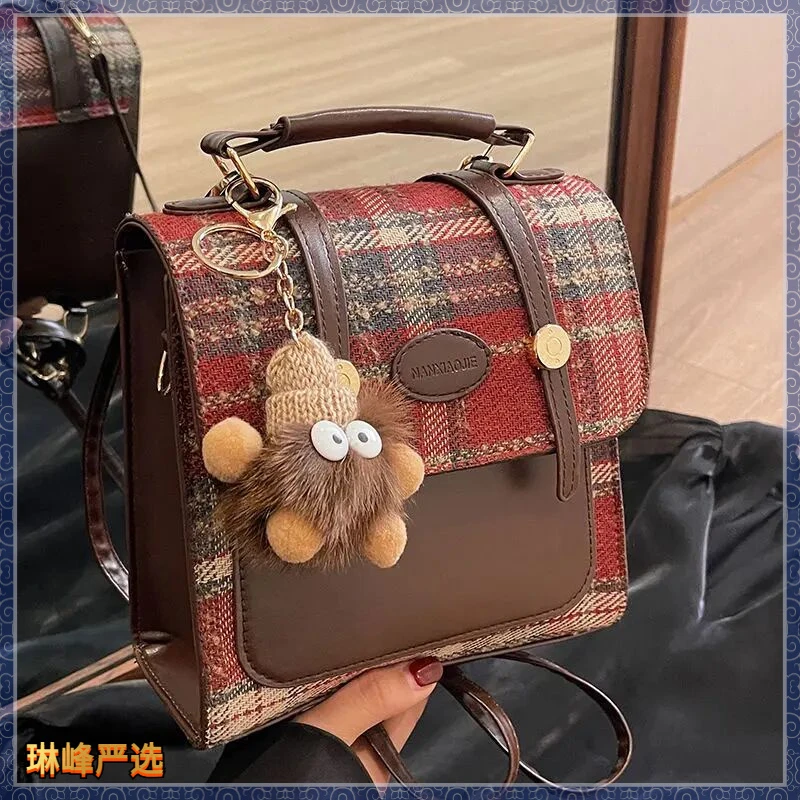 高级感小众搭扣双肩包女2024新款时尚女士学生百搭单肩斜挎包D781