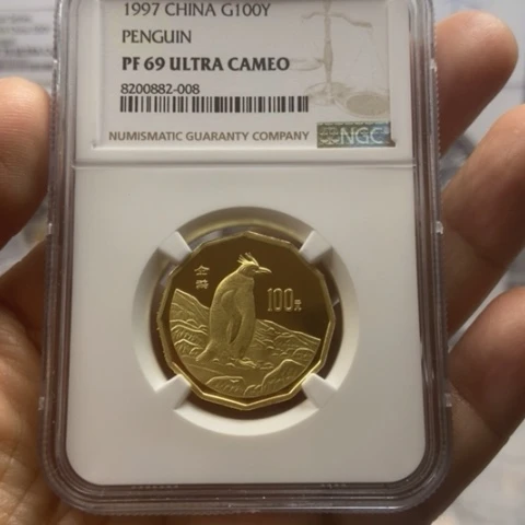 纯金1997年企鹅金币带证书NGC69分