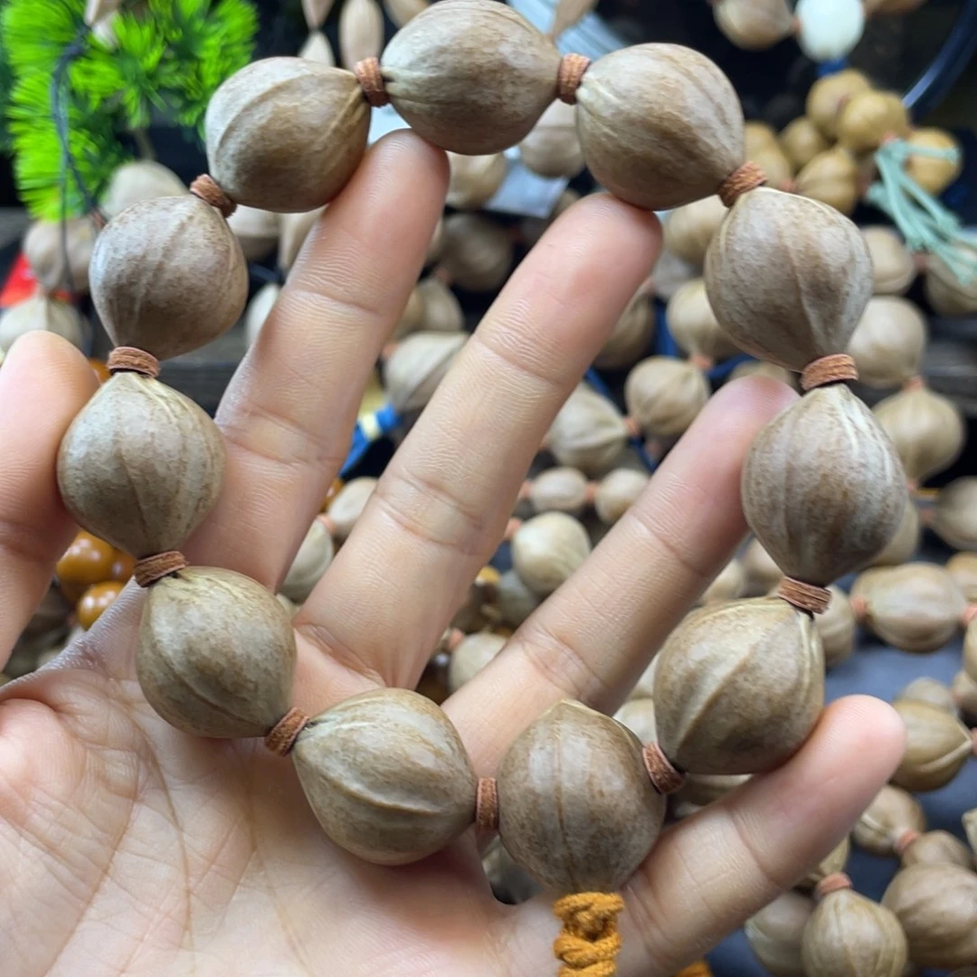 飞***卷吊坠橄榄核21x27红核