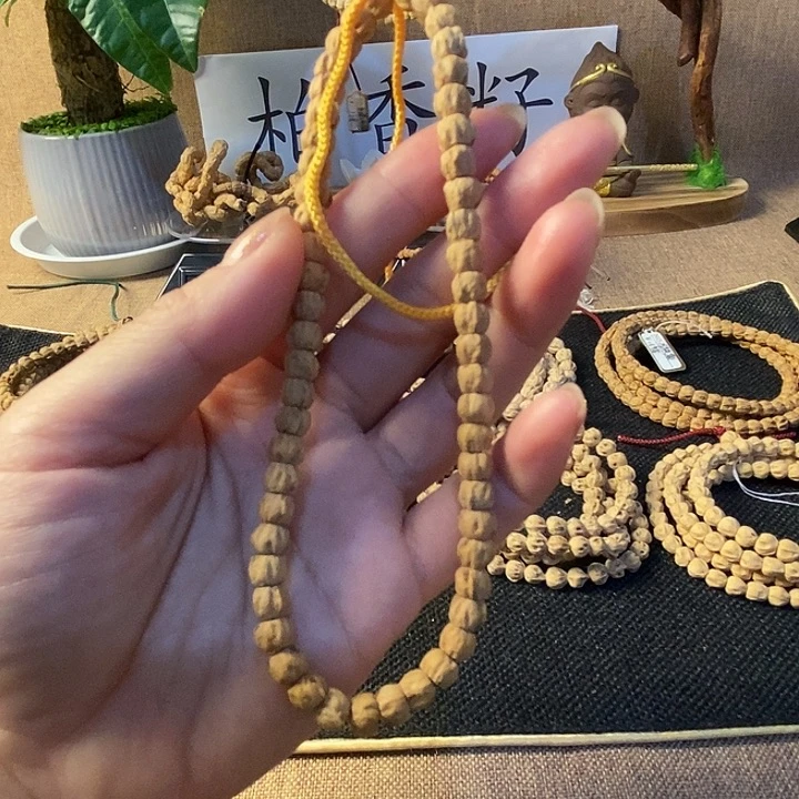 闲***影柏香籽/百香籽吊坠