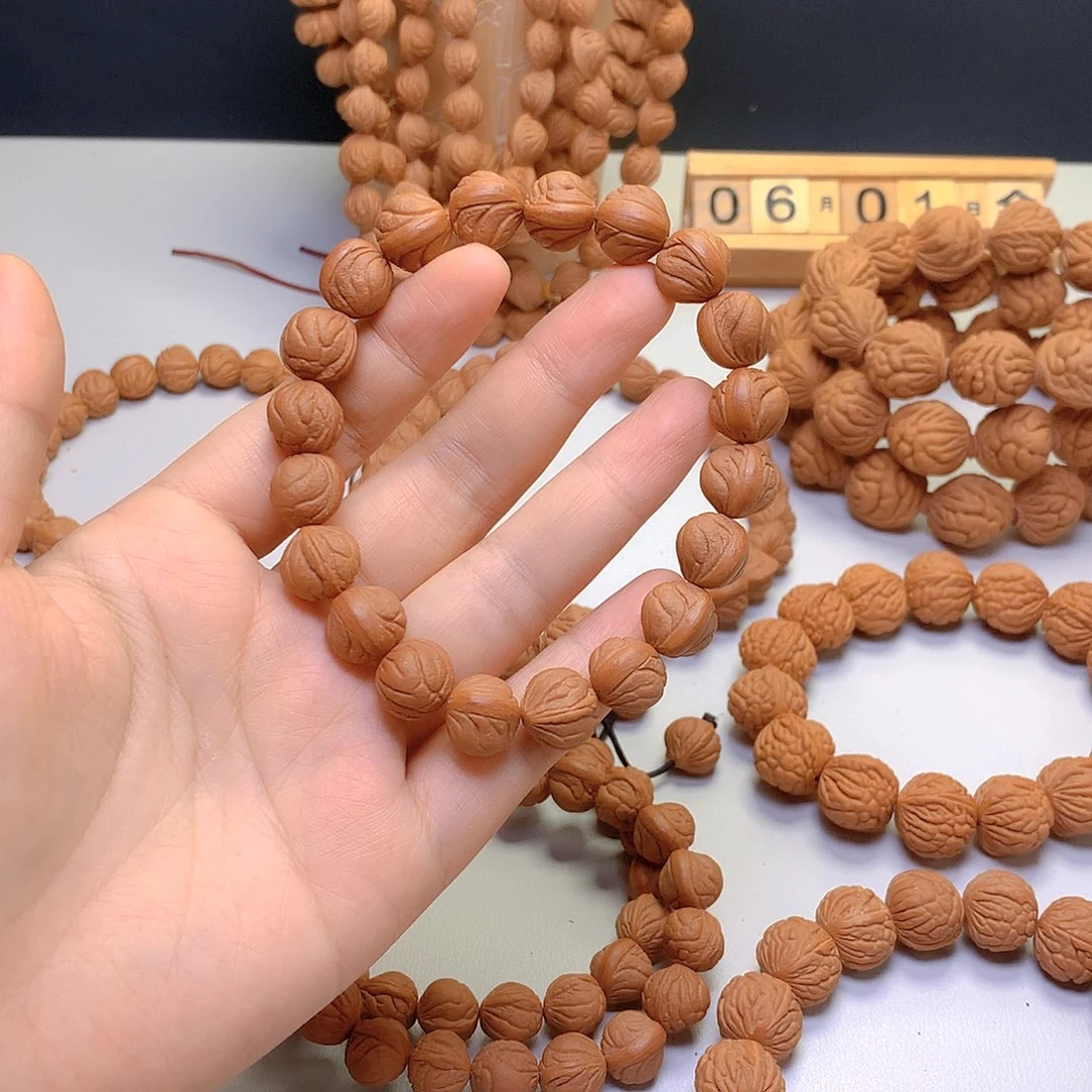 桃核吊坠李**棒玉龙脊手串