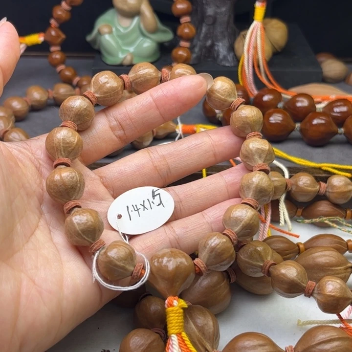 回***笑手串/手链橄榄核1.4*1.5原皮三带三通铁核树王