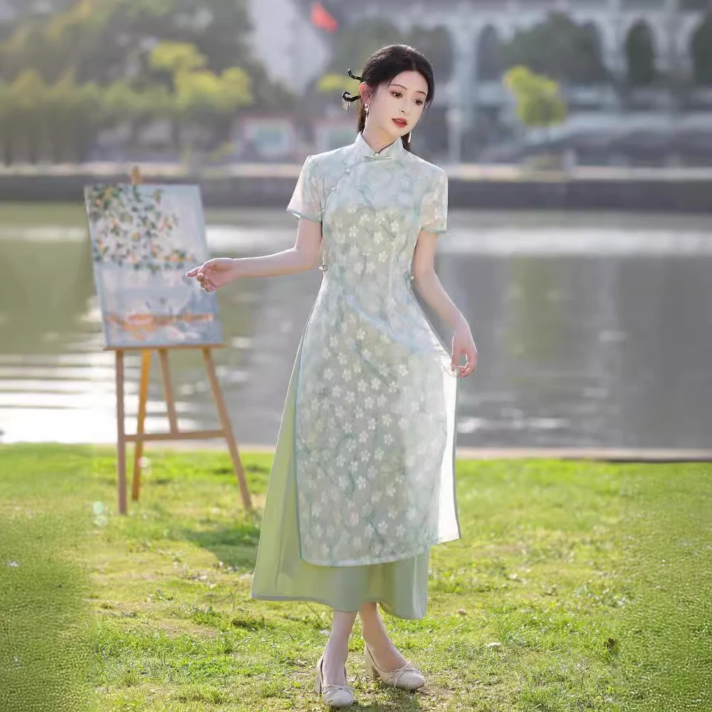 旗袍绿色一路绿灯夏季新款奥黛风清新少女长款连衣裙