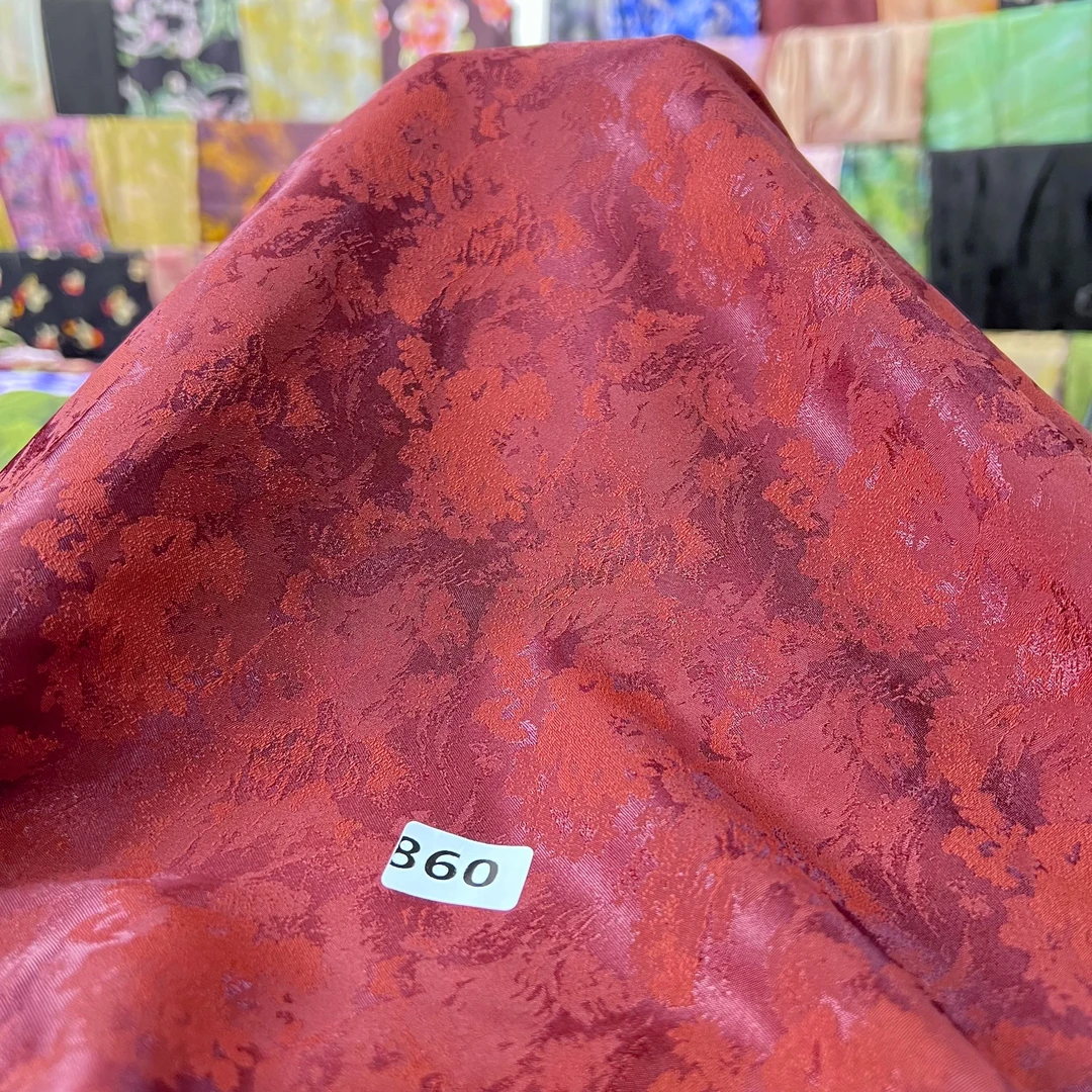 【860】砖红幻彩阳离子云锦缎面料