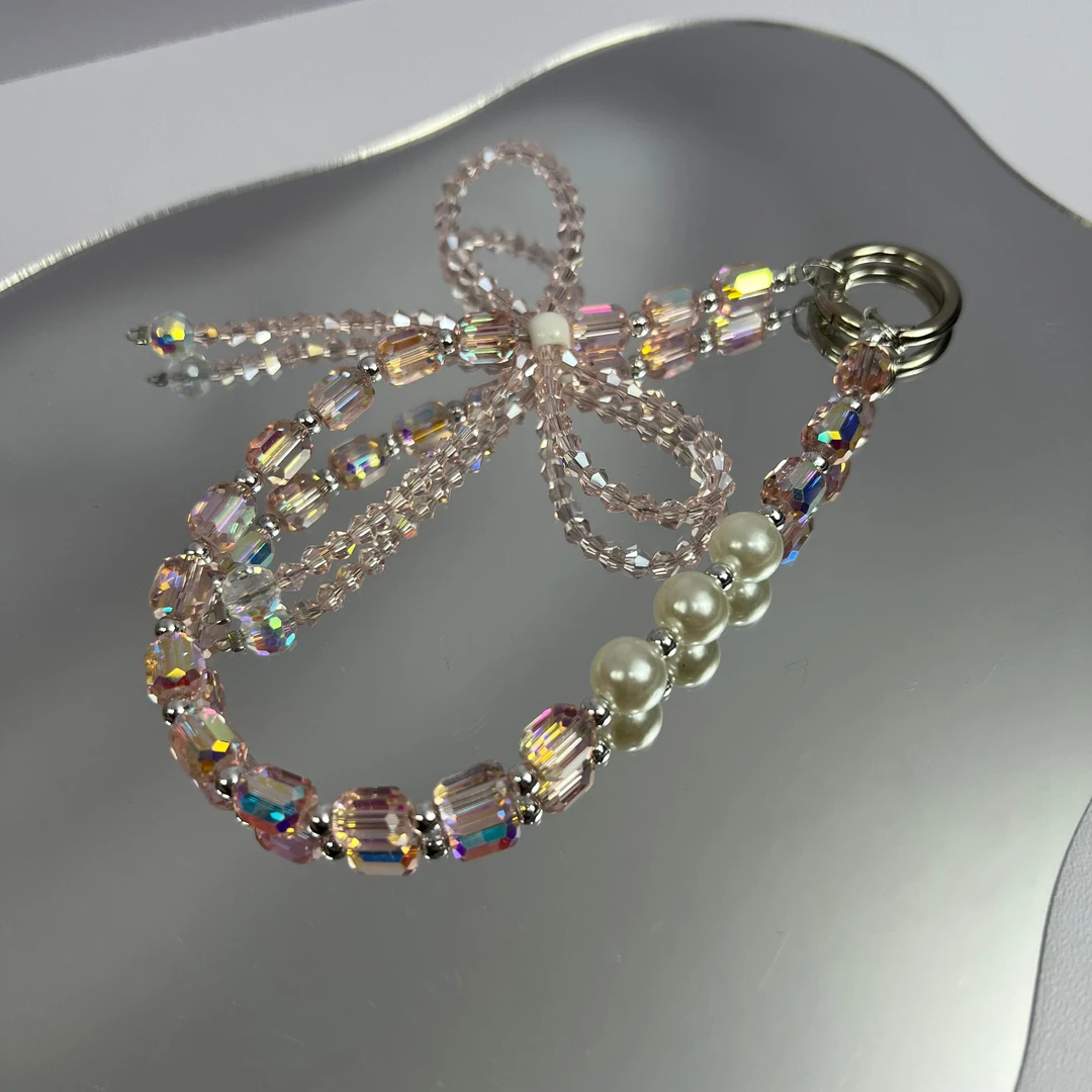 珍珠水钻蝴蝶结手机链短款手腕挂绳串珠挂饰高级感链条相机挂件女