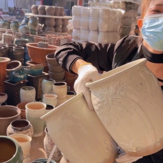 紫砂花盆高27口28。