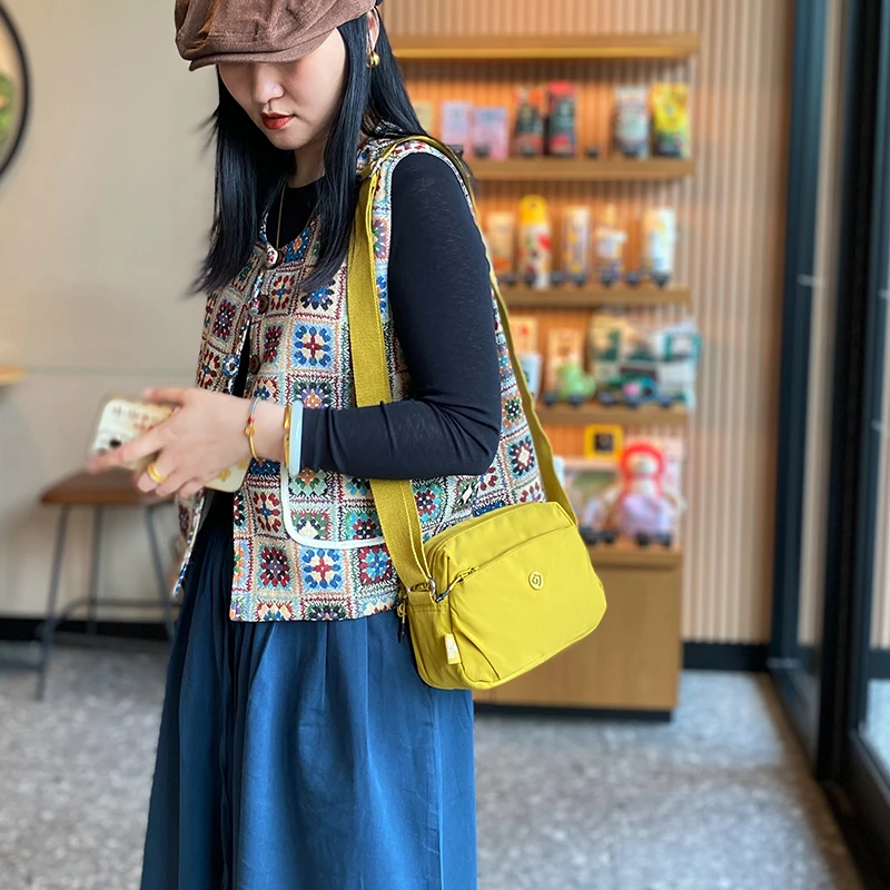 包包女时尚多层小包包2025夏季新款百搭女士包单肩斜挎牛津布背包