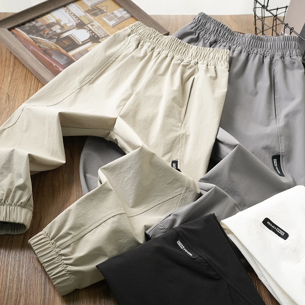 儿童夏季弹力拼接速干裤百搭简约长裤中大童男童束脚长裤25223