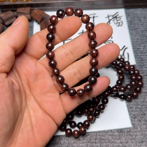 藤类y08海南红降0.8瑕疵圆珠手串