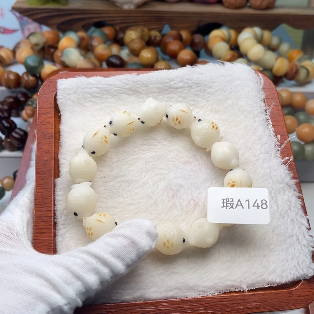 菩提根/象牙果吊坠瑕A148鱼14mm一串