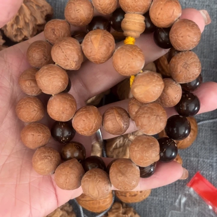 文玩核桃吊坠紫金鼠凤眼