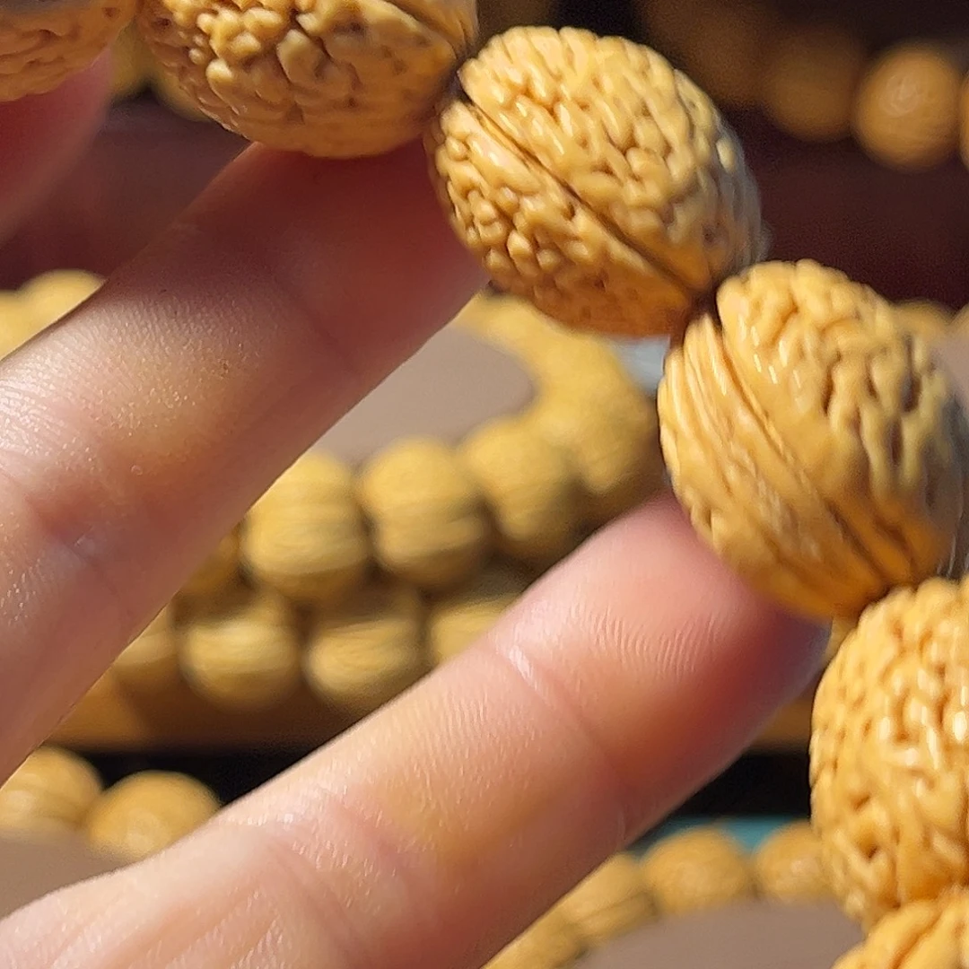 L***r手串文玩核桃东北野生桃核精品钱袋子手串