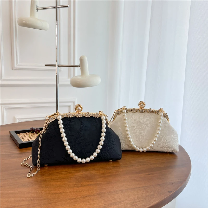 轻奢浮雕花纹大容量手提包斜挎包单肩包高品质口金包黑白复2519