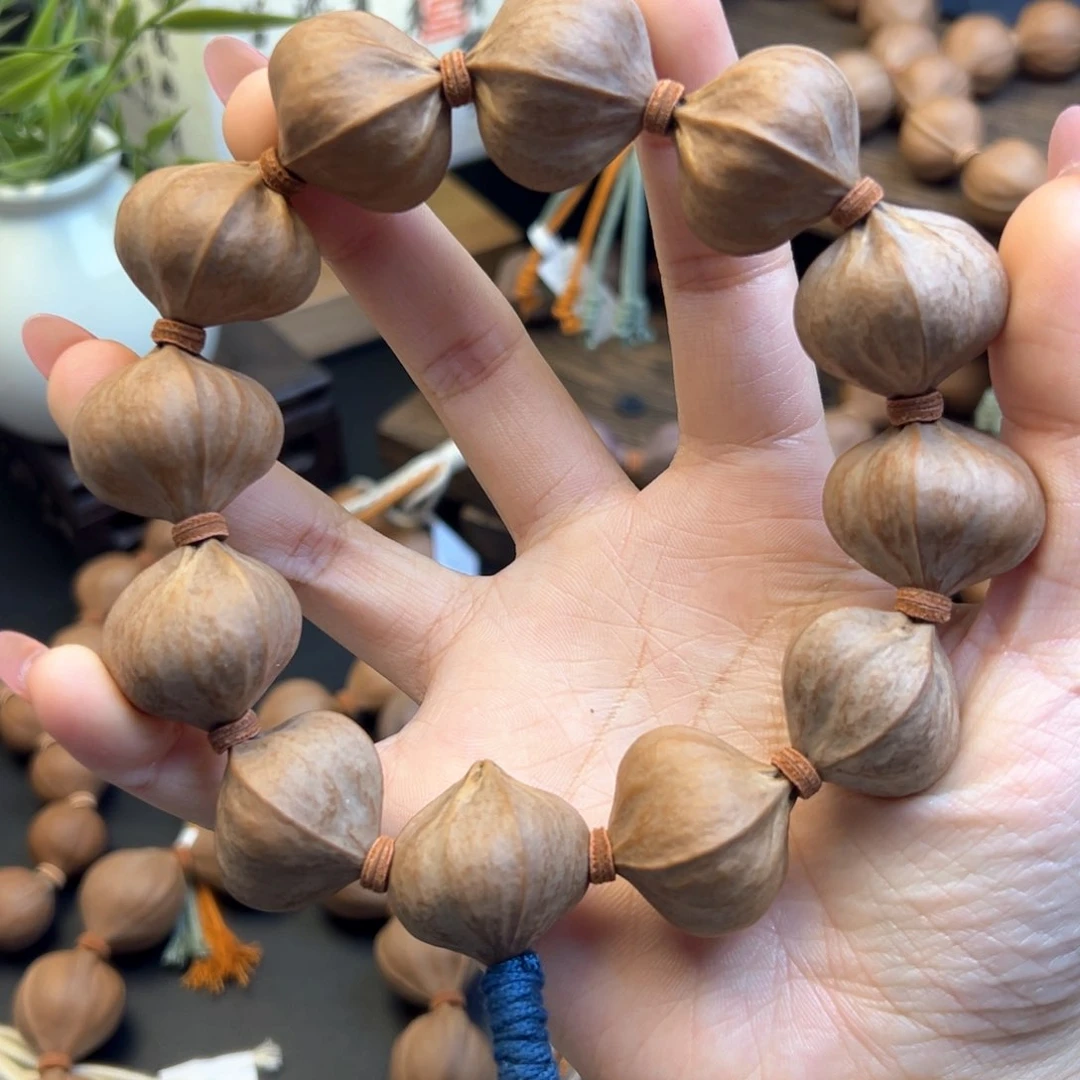 手串橄榄核001 25×24 四花