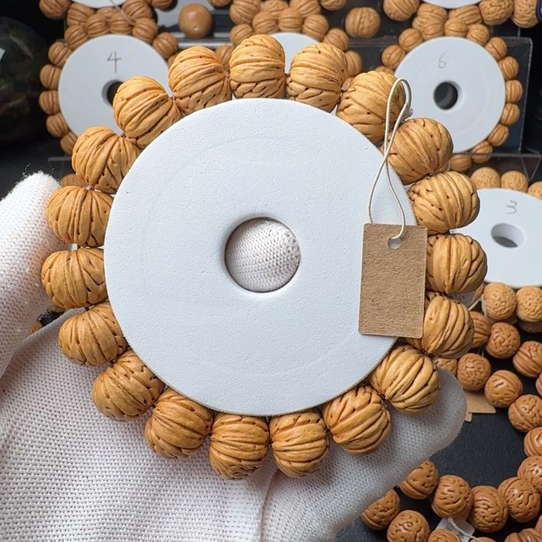 L***c手串桃核树王纽扣