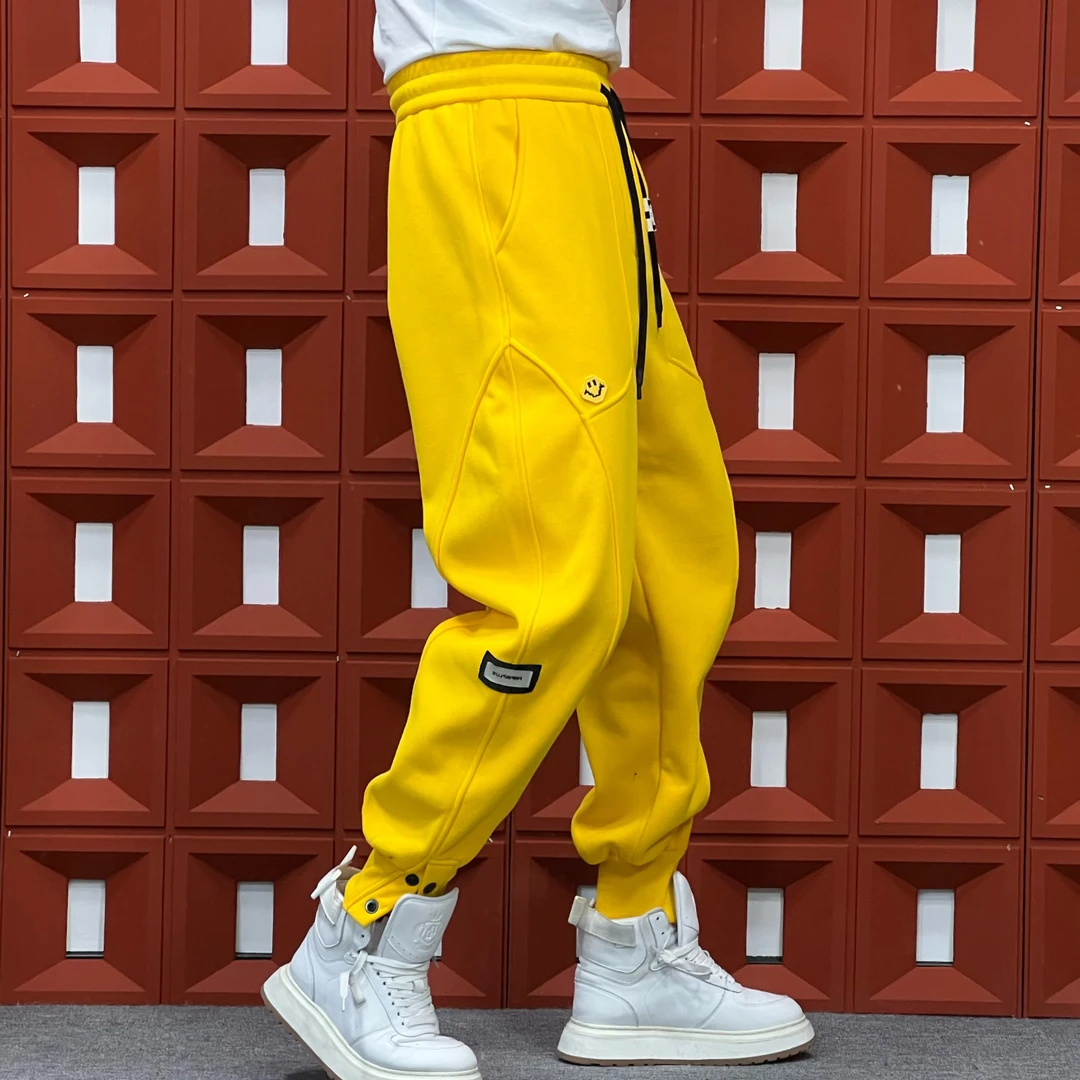 ★HKNB冬季新款多色立体时尚结构裁剪拼接暗扣笑脸束脚休闲卫裤