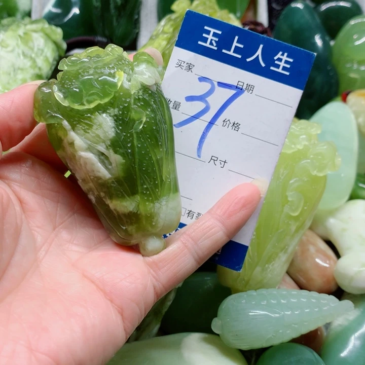 团***子蛇纹石玉未镶嵌手把件