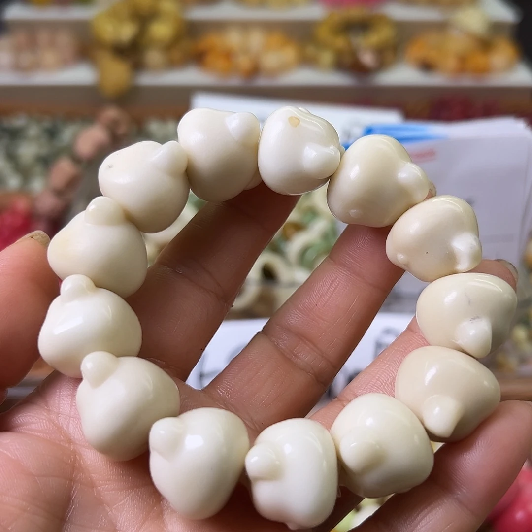 菩提根/象牙果手串瑕疵白熊头1条孔道有裂