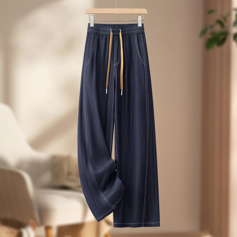 深蓝色松紧腰牛仔裤女秋款大码胖mm宽松显瘦梨形身材抽绳弯刀裤子