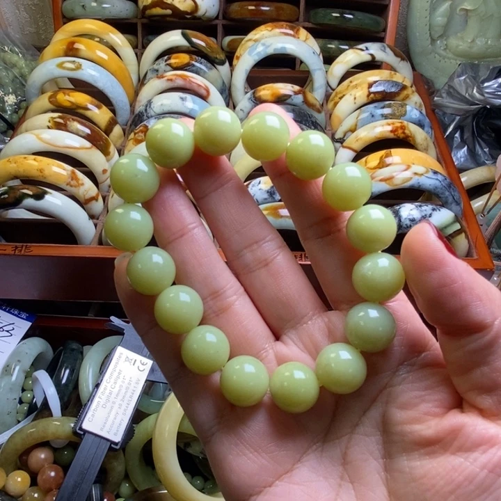 蛇纹石玉手串未镶嵌移***砖