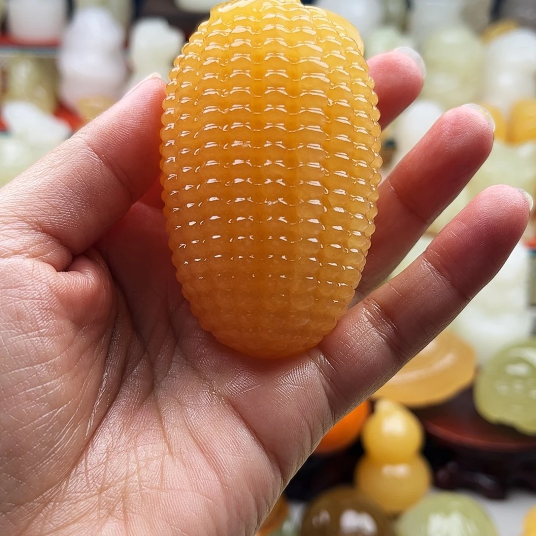 郑***~石材玉米手把摆件