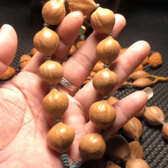 橄榄核手串何**月素皮手串