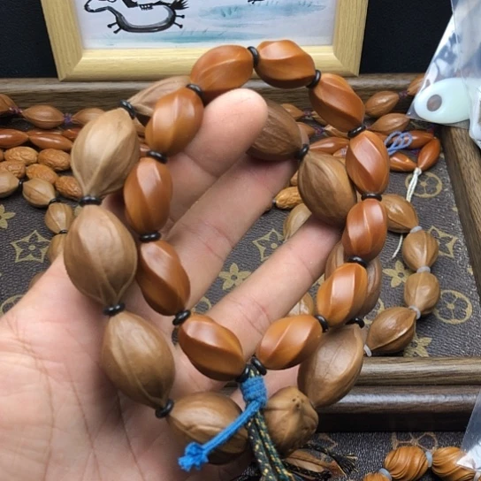 喜***卿橄榄核吊坠图同默默