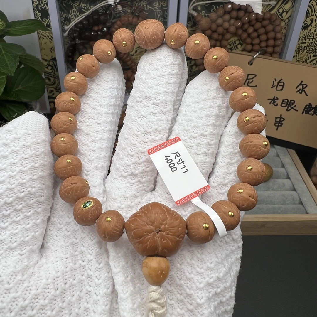 11mm尼泊尔凤眼菩提矮圆红皮金钉宝石眼实心籽手串