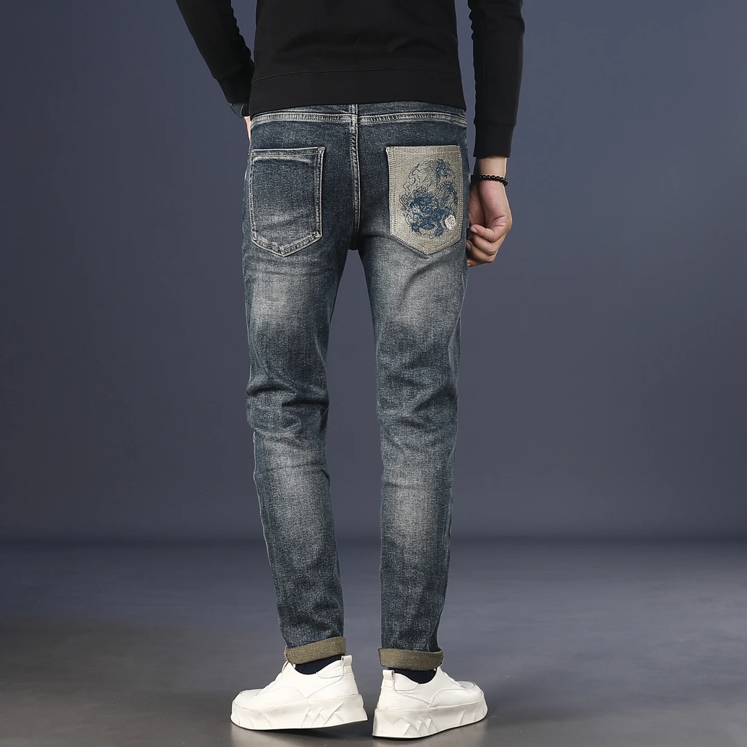 潮牌印花牛仔裤男款爆款2025新款秋冬款修身小脚弹力显瘦男士裤子