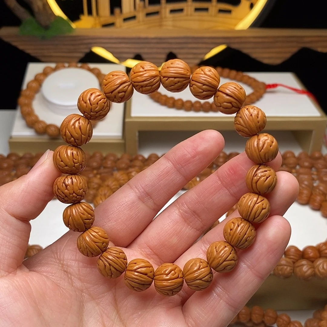 芥***酒手串桃核11mm野生金麒麟桃核手串