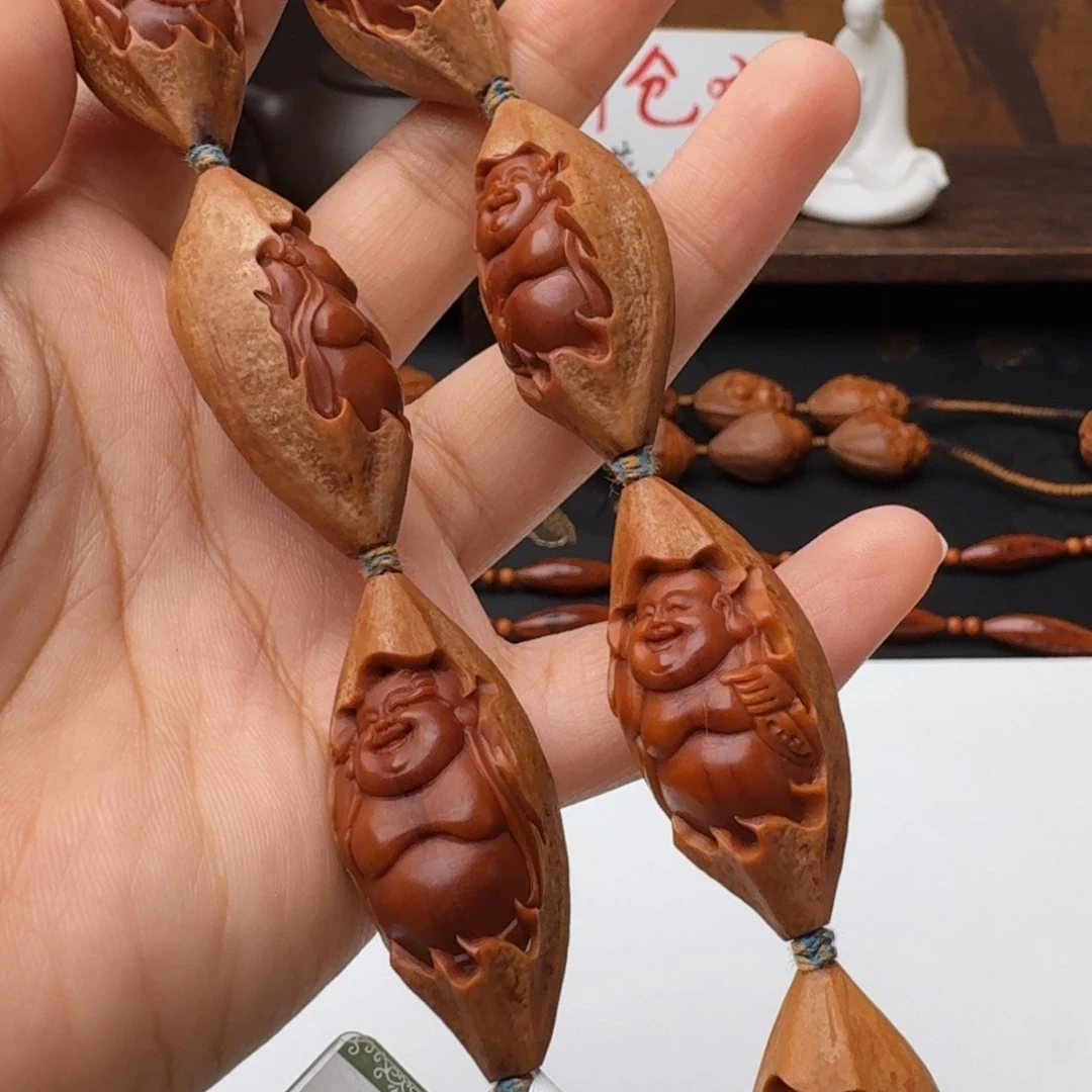 钮***头手串/手链橄榄核包衣弥勒（微花）