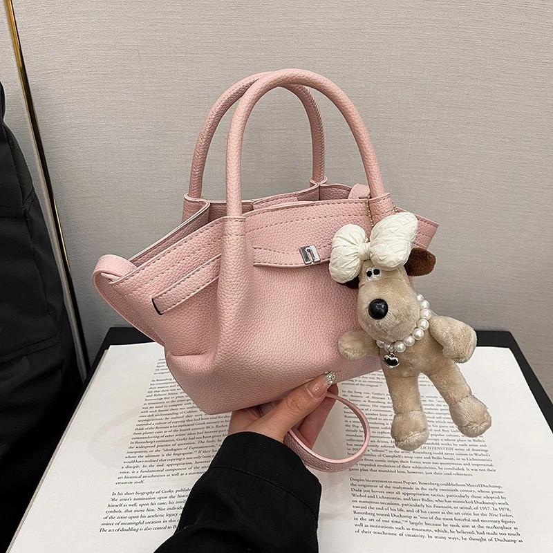 时尚休闲手提包包女2025春新款简约休闲单肩包通勤纯色斜跨水桶包