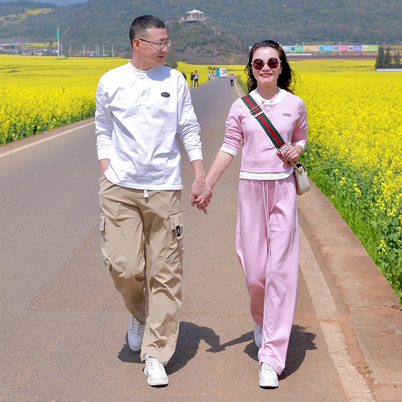 韩版粉色休闲运动套装2025年春季气质假两件长袖T恤阔腿裤两件套