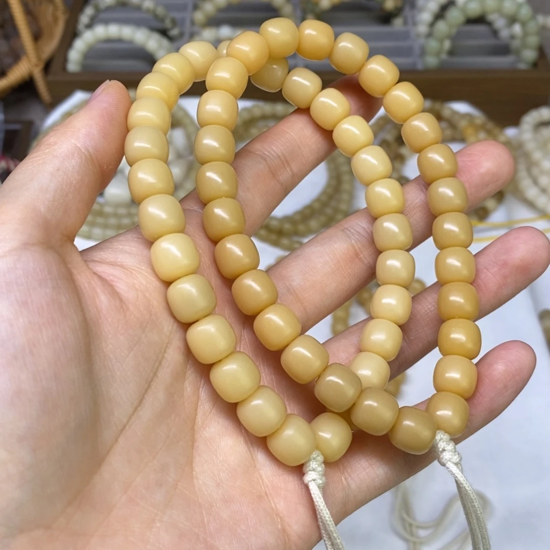 金***豆吊坠菩提根/象牙果金豆