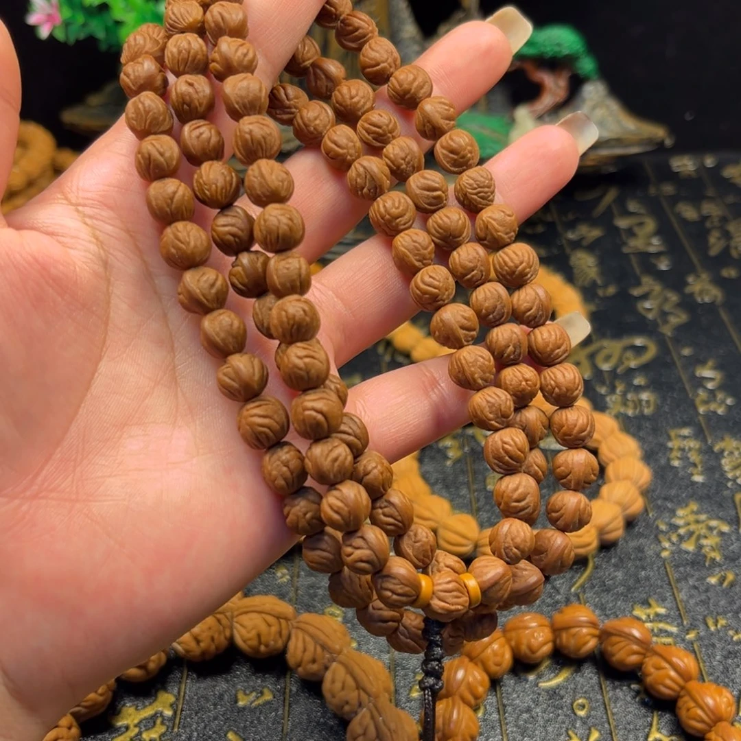 南***忆桃核吊坠玉龙脊手串